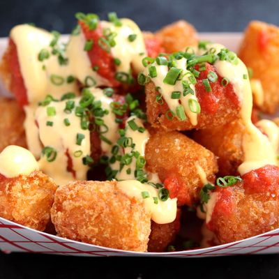 Tabasco Tots are topped with Tabasco mayo, tomato, and pizza spices.