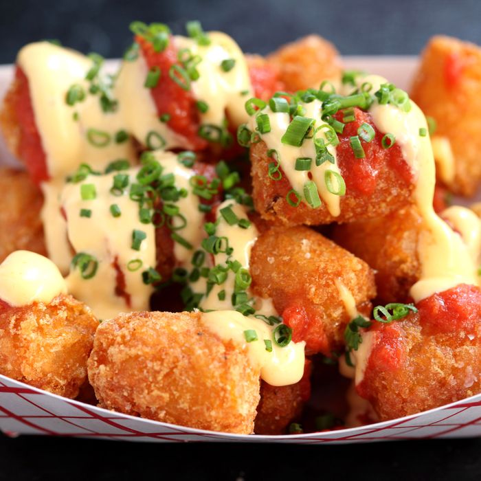 Tabasco Tots are topped with Tabasco mayo, tomato, and pizza spices.
