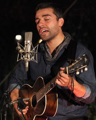 Actor Oscar Issac performs onstage during reception honoring Joel and Ethan Coen and T Bone Burnett to celebrate the music of 