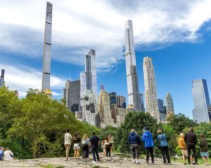 CENTRAL PARK, NEW YORK, USA - SEPTEMBER 15, 2023.  Sightseeing tourists waiting to take photos for social media in a popular viewpoint in Central Park
