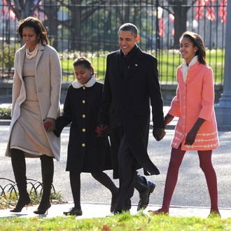 U.S. President Barack Obama, first lady Michelle Obama (L) and daughters Malia Obama (R) and Sasha Obama (2L)