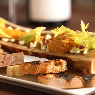 Bone marrow with sea urchin, Meyer lemon aioli, focaccia, and celery leaves.
