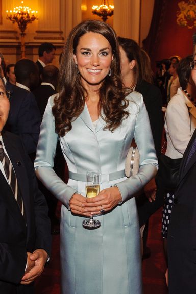 Catherine (C), Duchess of Cambridge, poses with President of Mongolia Elbegdorj Tsakhia (L) during a reception at Buckingham Palace to welcome Heads of State and Heads of Government to the UK before attending the opening ceremony of the London 2012 Olympic Games in London on July 27, 2012.