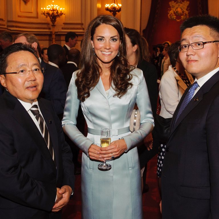 Catherine (C), Duchess of Cambridge, poses with President of Mongolia Elbegdorj Tsakhia (L) during a reception at Buckingham Palace to welcome Heads of State and Heads of Government to the UK before attending the opening ceremony of the London 2012 Olympic Games in London on July 27, 2012.