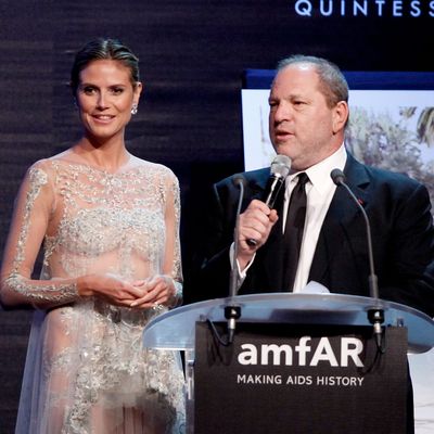 (L-R) Heidi Klum and producer Harvey Weinstein speak onstage during the 2012 amfAR's Cinema Against AIDS during the 65th Annual Cannes Film Festival at Hotel Du Cap on May 24, 2012 in Cap D'Antibes, France. 