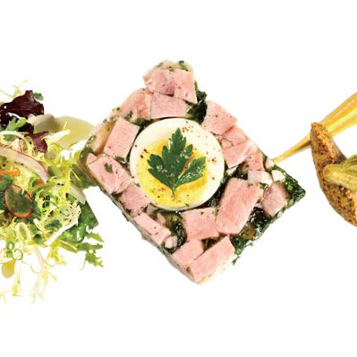 Ham terrine en gelee with parsley and egg.