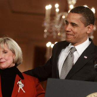 WASHINGTON - JANUARY 29: U.S. President Barack Obama hugs Lilly Ledbetter before signing the 