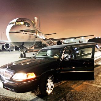 LOS ANGELES, CA - FEBRUARY 06: Fall Out Boy departs a private jet at Los Angeles Airport before their performance on the roof of the Pacific Stock Exchange Building as part of MTV's 