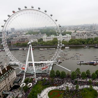 The flotilla of boats passes by the London Eye during the Diamond Jubilee Thames River Pageant on June 3, 2012 in London, England. For only the second time in its history the UK celebrates the Diamond Jubilee of a monarch. Her Majesty Queen Elizabeth II celebrates the 60th anniversary of her ascension to the throne. Thousands of well-wishers from around the world have flocked to London to witness the spectacle of the weekend's celebrations. The Queen along with all members of the royal family will participate in a River Pageant with a flotilla of a 1,000 boats accompanying them down the Thames.