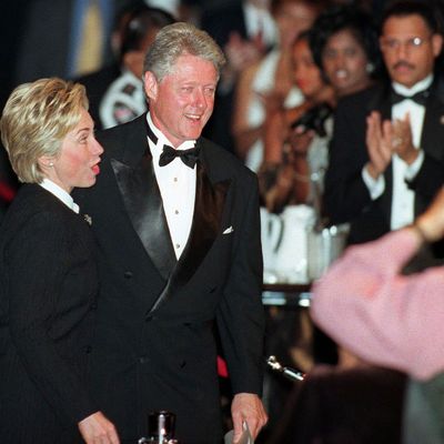 US President Bill Clinton and his wife Hillary are given an applause by the crowd after Clinton delivered his speech at the Congressional Black Caucus Foundation awards dinner 18 September, 1999 in Washington, DC. 