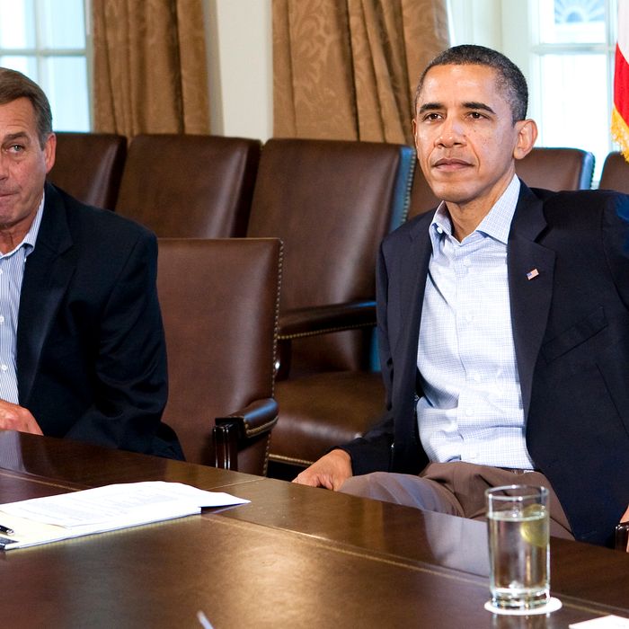 U.S. President Barack Obama (R) meets with Speaker of the House John Boehner (R-OH) (L) in the Cabinet Room of the White House.