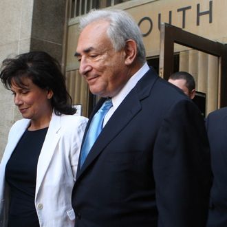 NEW YORK - JULY 1: Former International Monetary Fund leader Dominique Strauss-Kahn (C) and his wife Anne Sinclair (2nd L) leave New York State Supreme Court for a hearing July 1, 2011 in New York City. The Manhattan district attorney's office agreed to release Strauss-Kahn without bail after the credibility of the alleged sexual assault victim had come into question. Strauss-Kahn was arrested on May 14 on sexual assault charges stemming from an incident in a New York hotel. (Photo by Daniel Barry/Getty Images)