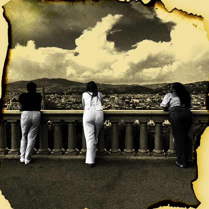 Three women standing a few feet apart from each other lean over a balustrade. The skyline of Florence, Italy stretches out in front of them.