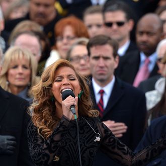 Beyonce performs the National Anthem as Vice-President Joe Biden, his wife Dr. Jill Biden (2nd L), his son Beau Biden (C background), former President Bill Clinton (far L) and wife, US Secretary of State Hillary Clinton (C-background), and US Justice Anthony Kennedy (R) listen during the 57th Presidential Inauguration ceremonial swearing-in at the US Capitol on January 21, 2013 in Washington, DC.