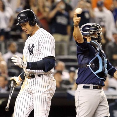 Alex Rodriguez #13 of the New York Yankees reacts after striking out with the bases loaded in the fifth inning