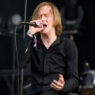 DERBY, UNITED KINGDOM - JUNE 10: Dennis Lyxzen of Swedish hardcore punk band Refused, performing live onstage at Download Festival, June 10, 2012. (Photo by Will Ireland/Classic Rock Magazine via Getty Images)
