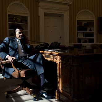 President Barack Obama talks on the phone with British Prime Minister David Cameron in the Oval Office, Feb. 13, 2012