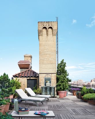 At right, Hollywood juniper and scaevola are in bloom on the rooftop.