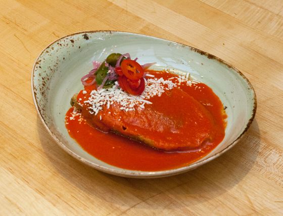 Chiles rellenos con hongos, queso fresco, raja, e salsa rojo.