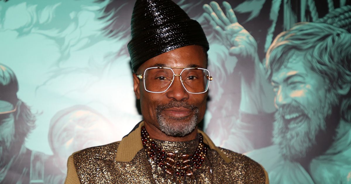 Billy Porter posing in a stylish outfit at a public appearance