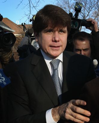 Former Illinois Governor Rod Blagojevich leaves his home to go to his sentencing hearing December 7, 2011 in Chicago, Illinois. Federal prosecutors are seeking a sentence of 15 to 20 years in prison for Blagojevich after he was found guilty of 17 public corruption charges. 