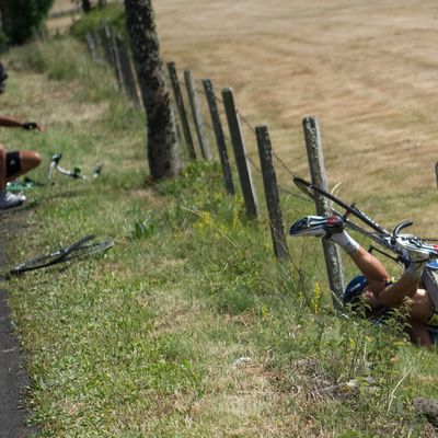 One of the breakaway men, Netherland's Johnny Hoogerland (R) is seen in the barbed-wire after he crashed at the side of the road with Spain's Juan Antonio Flecha (L) during the 208 km and ninth stage of the 2011 Tour de France cycling race run between Issoire and Saint-Flour, center rance, on July 10, 2011. Hoogerland and Hoogerland survived being hit at speed by a car which bore the marking of France Televisions. AFP PHOTO / LIONEL BONAVENTURE (Photo credit should read LIONEL BONAVENTURE/AFP/Getty Images)