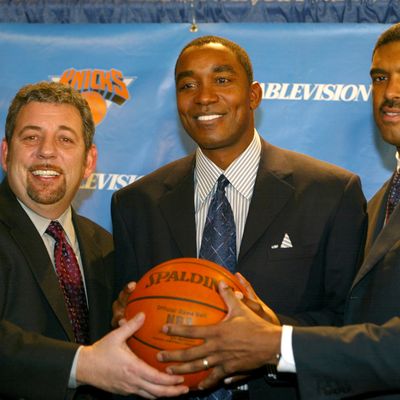 (L-R) Cablevision chairman James Dolan, newly hired New York Knicks General Manager and Team Presedient Isiah Thomas and President of Madison Sqaure Garden Sports Steve Mills pose for a photo op following a press conference that announced the firing of Scott Layden as Knicks Team President and GM and the hiring of Thomas as his replacement on December 22, 2003 at Madison Square Garden in New York City.