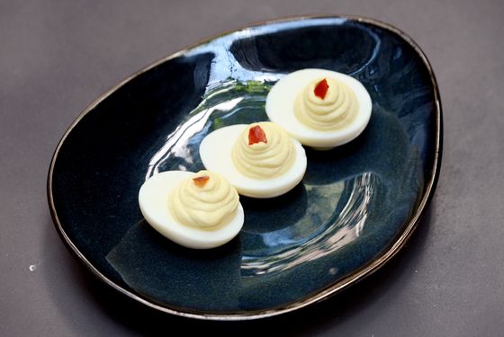 Deviled eggs with Sriracha flakes.