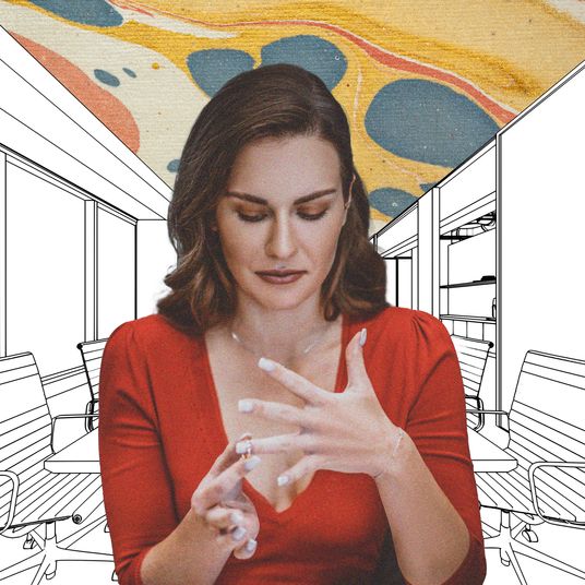 Woman getting divorced looking at ring work