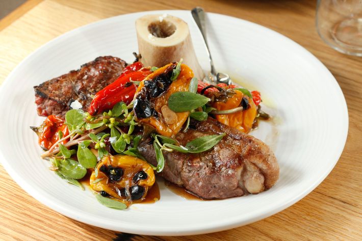 NY Steak with bone marrow, purslane, and marinated peppers.