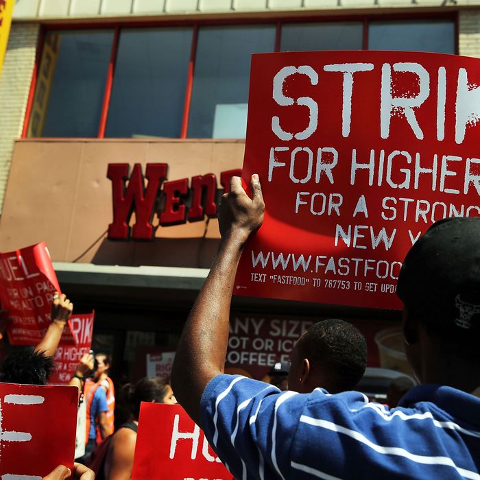 Employees and supporters demonstrate outside of a Wendy's fast-food restaurant to demand higher pay and the right to form a union on July 29, 2013 in New York City. Across the country thousands of low-wage workers are expected to walk off their jobs Monday at fast food establishments in seven U.S. cities. Workers at KFC, Wendy's, Burger King, McDonald's and other restaurants are calling for a living wage of $15 an hour and the right to form a union without retaliation. 