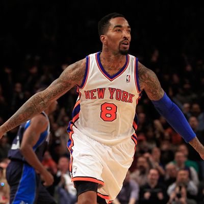 J.R. Smith #8 of the New York Knicks celebrates scoring a three pointer against the Dallas Mavericks at Madison Square Garden on February 19, 2012 in New York City. 