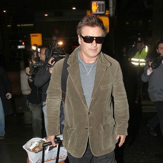 Alec Baldwin touches ground at American Airlines in JFK airport in New York after reportedly being thrown off his flight earlier in the day for allegedly not turning off his phone.