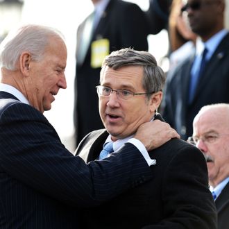 US Vice President Joe Biden (L) greets Illinois Senator Mark Kirk upon his return to the Senate on January 3, 2013 after suffering a stroke last January. Krik was welcomed by his colleagues on the step of the Senate a year after a stroke affected the right side of his brain. Kirk spent a year relearning how to walk in intensive physical therapy. The 113th Congress convenes Thursday fresh from the year-end fiscal cliff fiasco, but lawmakers will ring in 2013 casting a wary eye towards the even tougher budget battles that lie ahead. AFP PHOTO/JEWEL SAMAD (Photo credit should read JEWEL SAMAD/AFP/Getty Images)