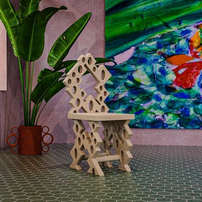 The Designer Behind Café Mars's Bright Wooden Chairs