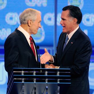 LAS VEGAS, NV - OCTOBER 18: U.S. Rep. Ron Paul (R-TX) (L) and former Massachusetts Gov. Mitt Romney shake hands after the Republican presidential debate airing on CNN, October 18, 2011 in Las Vegas, Nevada. Seven GOP contenders are taking part in the debate, which is sponsored by the Western Republican Leadership Conference in Las Vegas and held in the Venetian Hotel's Sands Expo and Convention Center. (Photo by Ethan Miller/Getty Images)