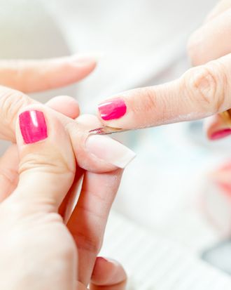 Hmm, it appears that the manicurist has cooler nails than the customer in this picture. 