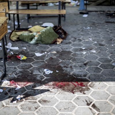 A trail of blood is seen in the courtyard of a UN School in the northern Beit Hanun district of the Gaza Strip on July 24, 2014, after it was hit by an Israeli tank shell. At least nine people were killed, including a baby, when an Israeli tank shell slammed into a UN-run school in the northern Gaza Strip, an AFP correspondent said. 