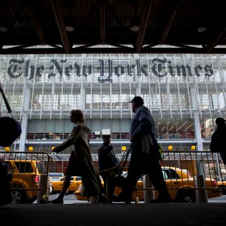 Pedestrians pass in front of the New York Times Co. building in New York, U.S., on Wednesday, April 27, 2011. New York Times Co., publisher of the namesake newspaper, said more than 100,000 people signed up for new digital subscriptions, a sign online revenue may help offset a decline in print advertising and circulation. Photographer: Michael Nagle/Bloomberg via Getty Images