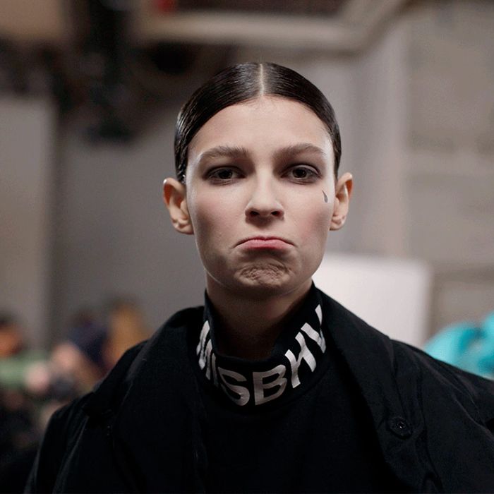 A model pouts at Thom Browne. 