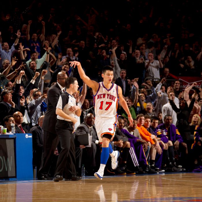 Jeremy Lin #17 of the New York Knicks reacts to the crowd after hitting a three point shot during the game against the Los Angeles Lakers on February 10, 2012 at Madison Square Garden in New York City. 