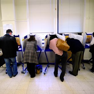New York residents cast their vote in the US mid-term elections at a polling station at a school in Harlem in New York, November 2, 2010.