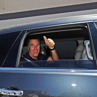 Republican presidential candidate and former Massachusetts Gov. Mitt Romney gives a thumbs up after speaking to supporters in front of vacant stores of the Valley Plaza shopping center to a campaign stop on July 20, 2011 in Los Angeles, California. 