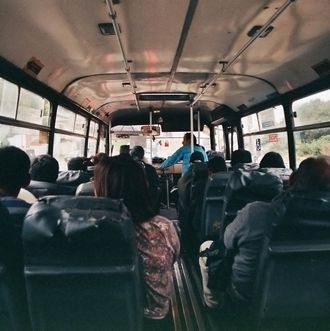 Rear view of people traveling in bus