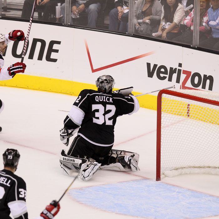 Adam Henrique #14 of the New Jersey Devils scores a goal over goaltender Jonathan Quick #32 of the Los Angeles Kings in the third period of Game Four of the 2012 Stanley Cup Final at Staples Center on June 6, 2012 in Los Angeles, California.