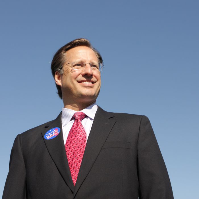 GLEN ALLEN, VA - APRIL 26: College economics professor and Republican candidate for Congress David Brat (C) poses for a photograph after attending the Henrico County Republican Party breakfast meeting April 26, 2014 in Glen Allen, Virginia. Brat went on to a surprise defeat of incumbent House Majority Leader Eric Cantor in the June 10 primary. (Photo by Jay Paul/Getty Images)