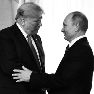 Melania Trump looks on as Donald Trump and Vladimir Putin shake hands.
