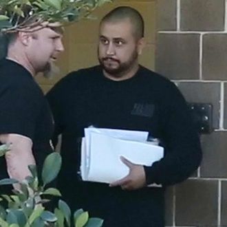 George Zimmerman walks out of the Seminole County Jail after a first appearance at the Seminole County Courthouse in Sanford, Fla., on Saturday, Jan. 10, 2015. Zimmerman was charged with aggravated assault with a weapon in an incident where he allegedly threw a wine bottle.