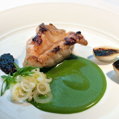 Grilled monkfish, green and black garlic, and lobster sauce.