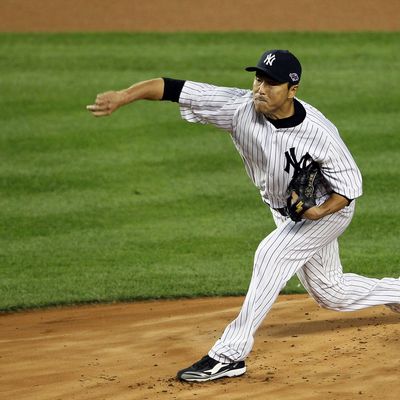 Hiroki Kuroda #18 of the New York Yankees pitches during Game Three of the American League Division Series against the Baltimore Orioles at Yankee Stadium on October 10, 2012 in the Bronx borough of New York City.